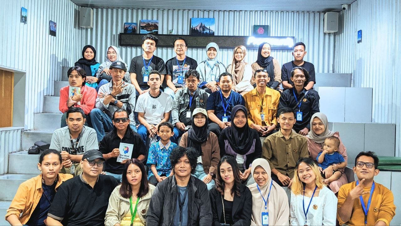 A learning community gathered for a group photograph