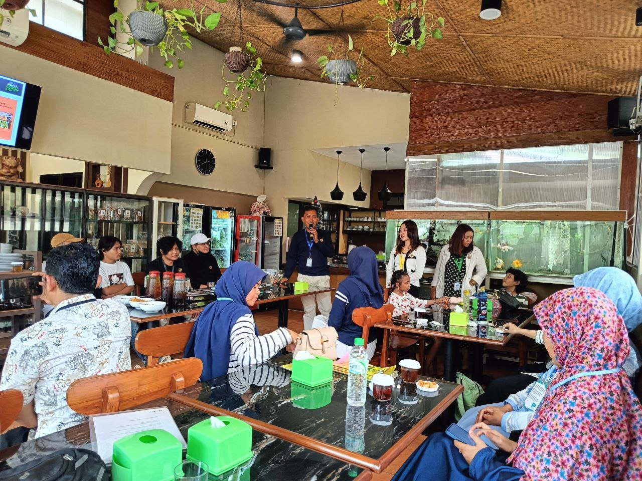 A facilitated workshop discussion with participants around several tables
